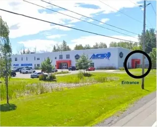 Exterior of the Muscle IQ building at 2600 Leitrim Road, Ottawa, with the entrance marked